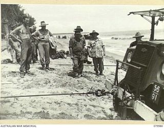 TOKO, BOUGAINVILLE, SOLOMON ISLAND. 1945-03-26. VX1 GENERAL SIR THOMAS BLAMEY, GBE, KCB, CMG, DSO, ED, COMMANDER- IN- CHIEF, ALLIED LAND FORCES, SOUTH WEST PACIFIC AREA (5), WITH SENIOR OFFICERS AT ..