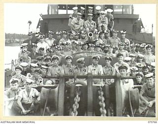 HOMBOLT BAY, NEW GUINEA. 1944-08/09. THE SHIP'S COMPANY OF THE RAN CORVETTE, GEELONG ASTERN OF THE BRIDGE