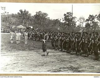 NEW GUINEA. 1943-11-20. NX8 LIEUTENANT GENERAL SIR LESLIE MORSHEAD KCB KBE CMG DSO ED, GENERAL OFFICER COMMANDING, NEW GUINEA FORCE (1), TAKING THE SALUTE FROM UNITS OF THE 18TH AUSTRALIAN INFANTRY ..