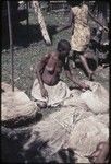 Mortuary ceremony: woman weaves long banana fiber skirts for exchange