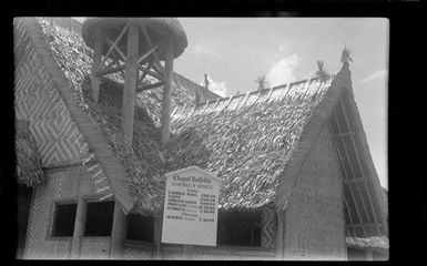 Exterior of Memorial Chapel, Gaudalcanal, Solomon Islands, showing schedule of services