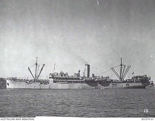 PORT SIDE VIEW OF THE AUSTRALIAN PASSENGER CARGO STEAMER MONTORO WHICH TRANSPORTED AUSTRALIAN TROOPS TO NEW GUINEA IN 1941 AND WITHDREW DEPENDENTS FROM DARWIN IN 1942-01. SHE IS ARMED WITH A 12 ..