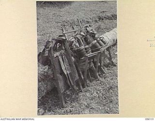 MUSCHU ISLAND, NEW GUINEA. 1945-09-11. IMPROVISED PRIMITIVELY CONSTRUCTED PACKS MADE BY JAPANESE TROOPS TO CARRY STORES AND PERSONAL GEAR. THE AREA IS NOW OCCUPIED BY HEADQUARTERS 6 DIVISION. THE ..