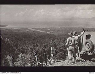 MILNE BAY, NEW GUINEA, 1943-07-11. TURNBULL'S STRIP SEEN FROM THE MAPO ROAD. THIS AIRSTRIP WAS USED BY THE RAAF AND THE UNITED STATES ARMY AIR CORPS