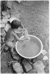 Child and tub of water
