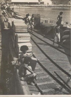 Papuan men on a dock, Port Moresby, Papua New Guinea.