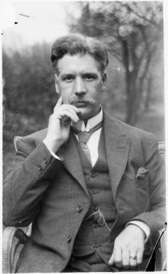 Unidentified man wearing a suit in the garden at Malaguna Road [?], Rabaul, New Guinea, ca. 1935 / Sarah Chinnery