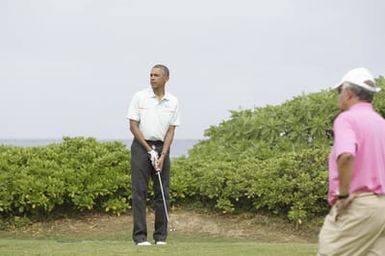 Barack Obama plays golf with Prime Minister Najib Razak, Joe Paulsen, and Mike Brush in Kaneohe Bay, Hawaii, December 24, 2014