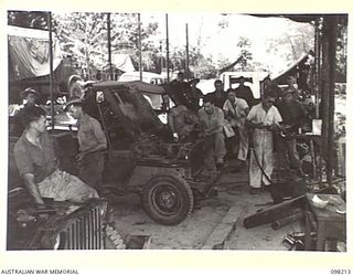 NAMANULA, NEW BRITAIN. 1945-10-19. A SECTION AT THE WORKSHOPS OF 290 LIGHT AID DETACHMENT, WHERE JEEPS ARE BEING OVERHAULED