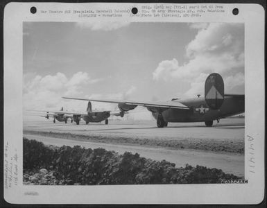 Consolidated B-24 Liberators Of The 11Th Bomb Group, Warming Up Motors Prior To Take Off On Mission From Kwajalein, Marshall Islands, July 1944. (U.S. Air Force Number C63804AC)