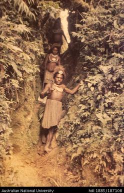 People walking down through a pass