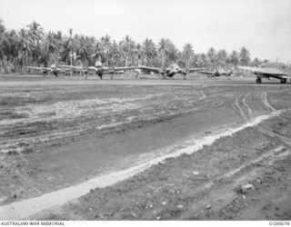 MILNE BAY, PAPUA. C. 1942-10. THREE BEAUFORT BOMBER AIRCRAFT OF NO. 100 SQUADRON RAAF PREPARING TO TAKE OFF FROM A MUDDY GURNEY AIRSTRIP. ALSO SHOWN IS A HUDSON BOMBER AIRCRAFT OF NO. 6 SQUADRON ..