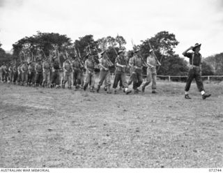 PORT MORESBY, NEW GUINEA. 1944-04-28. PERSONNEL OF THE 2/101ST GENERAL TRANSPORT COMPANY PASSING THE SALUTING BASE AT THE CONCLUSION OF AN INSPECTION OF THE UNIT BY NX34705 BRIGADIER P. S. MCGRATH, ..