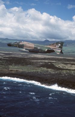 An air to air left side view of a 199th Tactical Fighter Squadron, Hawaii Air National Guard, F-4 Phantom II aircraft