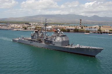 Portside view of the US Navy (USN) Ticonderoga Class Guided Missile Cruiser USS VINCENNES (CG 49) approaching Pearl Harbor, Hawaii (HI), for a scheduled port visit. This is the ship's last port call before being decommissioned at San Diego, California (CA)