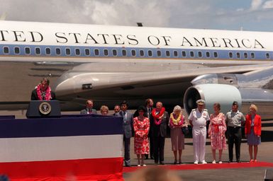 President Ronald Reagan addresses a crowd upon his arrival aboard Air Force One. The president and first lady are visiting Hawaii while en route to the Republic of China