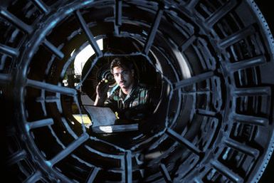 STAFF SGT. Mark Peleholani, a propulsion technician in the199th Tactical Fighter Squadron, Hawaii Air National Guard, inspects an aircraft engine