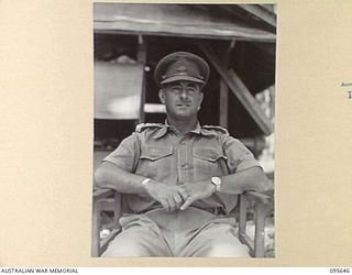 PALMALMAL, JACQUINOT BAY, NEW BRITAIN. 1945-09-01. CAPTAIN A.L. NYMAN, GENERAL STAFF OFFICER 1 AND 2 DIVISION, AT HEADQUARTERS 11 DIVISION