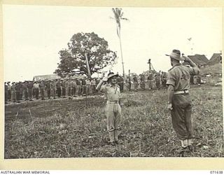 HELDSBACH MISSION, FINSCHHAFEN, NEW GUINEA. 1944-03-27. VX48626 MAJOR A. C. MENDELSOHN, SECOND IN CHARGE, 2/3RD CASUALTY CLEARING STATION (1), HANDING OVER THE PARADE TO THE COMMANDING OFFICER OF ..