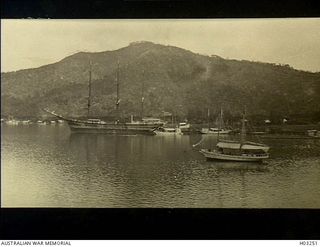 Simpson Harbour, New Britain. c. 1915. A variety of vessels in the harbour off Rabaul. The large sailing vessel is the American barque C.D. Bryant with the North Dargster behind. On the foreshore ..