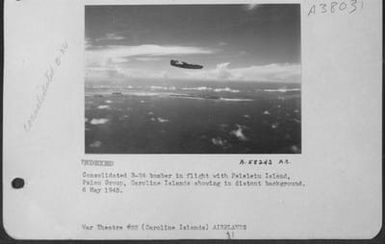 Consolidated B-24 Bomber In Flight With Peleleiu Island, Palau Group, Caroline Islands Showing In Distant Background. 6 May 1945. (U.S. Air Force Number A58243AC)