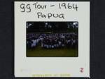 School children gathering waving Australian flags, Governor General's tour, Papua, 1964