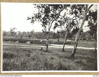 POM POM VALLEY, NEW GUINEA. 1943-11-30. GENERAL VIEW OF THE 2/12TH AUSTRALIAN INFANTRY BATTALION ON PARADE