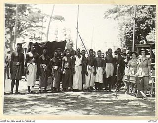 MADANG, NEW GUINEA. 1944-10-29. THE NATIVE CHOIR TRAINED AND CONDUCTED BY NX133195 CHAPLAIN M. BOLAND (1), ASSISTED BY ORGANISTS, NFX138792 SISTER A.M. KELLY, 2/11TH AUSTRALIAN GENERAL HOSPITAL (2) ..