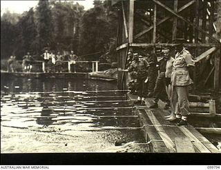 Torokina, Bougainville. 1945-11-04. Major General W. Bridgeford, CB CBE MC, General Officer Commanding 3 Australian Division, watching the finish of the 200 yard freestyle event at the Divisional ..