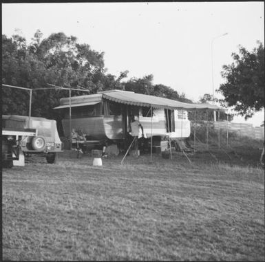 Man standing in front of his caravan, Isle of Pines, New Caledonia, 1967 / Michael Terry