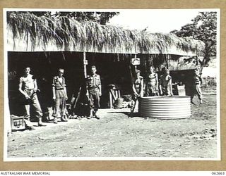 RAMU VALLEY, NEW GUINEA. 1943-12-21. PERSONNEL OUTSIDE THE PLATOON AREA WORKSHOP OF THE 53RD AUSTRALIAN FIELD PARK COMPANY, ROYAL AUSTRALIAN ENGINEERS, 7TH AUSTRALIAN DIVISION. SHOWN ARE: VX131755 ..