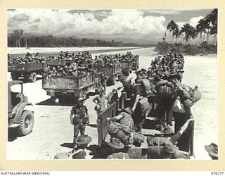 TOROKINA, BOUGAINVILLE ISLAND. 1945-01-02. TROOPS OF THE 24TH INFANTRY BATTALION, EMBUSSING FOR THE FINAL STAGE OF THEIR JOURNEY TO THE JABA RIVER AREA