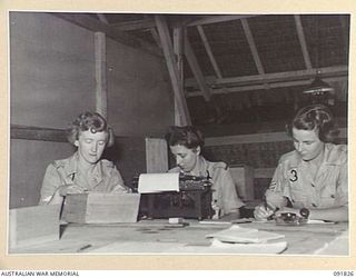 LAE, NEW GUINEA. 1945-05-15. STAFF OF AUSTRALIAN WOMEN'S ARMY SERVICE HEADQUARTERS WORKING AT HEADQUARTERS FIRST ARMY. IDENTIFIED PERSONNEL ARE:- CORPORAL M. WRAY (1); PRIVATE M. JENKINSON (2); ..