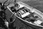 Skiff is prepared with diving gear, near Falcon Island, Tonga