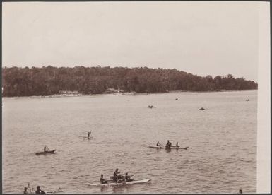 Islanders in canoes lying off Namambumba, Te Motu, Santa Cruz Group, Solomon Islands, 1906 / J.W. Beattie