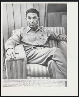 Recalled - . John B. Ackerman, relieved from his post as commander of the 13th Air Force in the Philippines, faces newsmen in his hotel during a stop in Hawaii on his way to Washington. Ackerman declined to comment on his recall or his next assignment.