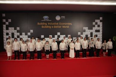 Barack Obama joins Asia Pacific Economic Cooperation Summit leaders and spouses for a group photo in Pasay, Metro Manila, Philippines, November 18, 2015