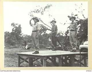 POM POM VALLEY, NEW GUINEA, 1944-02-16. NX8 LIEUTENANT-GENERAL SIR LESLIE MORSHEAD, KCB., KBE., CMG., DSO., ED., (1), GENERAL-OFFICER-COMMANDING NEW GUINEA FORCE, TAKES THE SALUTE AT THE FAREWELL ..