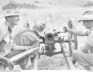 FORTIFICATION POINT, NEW GUINEA. 1944-04-06. A JAPANESE 75MM REGIMENT FIELD GUN, PACK TYPE, MEIJI 41, FIRED BY MEMBERS OF THE 2/14TH FIELD REGIMENT AT THE FRONTAL ARMOUR OF A DISABLED MATILDA TANK ..