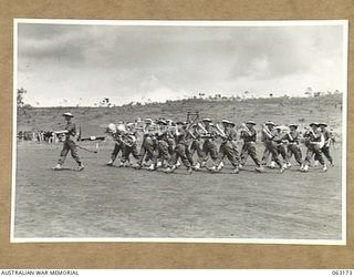 DONADABU, PAPUA, NEW GUINEA. 1944-01-01. THE BAND OF THE 24TH INFANTRY BATTALION MARCHING ON TO THE AREA AT THE START OF THE 15TH INFANTRY BRIGADE GYMKHANA