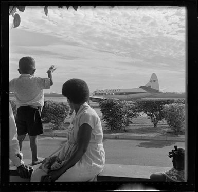 Locals watching Fiji Airways aeroplane, VQ-FAY, at Nadi Airport, Fiji