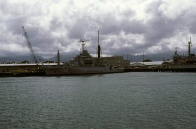 A port bow view of the submarine rescue ship USS SAFEGUARD (ARS 50) moored at the Bishop Point wharf