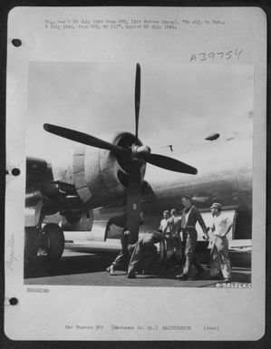 Mechanics At The Guam Air Depot Turn The Heavy Prop Of The First Boeing B-29 To Be Overhauled After The Depot Began Operations. Marianas Gp. (U.S. Air Force Number B58121AC)