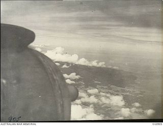 BISMARCK ARCHIPELAGO. 1944-03-28. PART OF NEW BRITAIN AS SEEN FROM A BEAUFIGHTER AIRCRAFT OF NO. 30 SQUADRON RAAF FLOWN BY FLIGHT SERGEANT T. BOEHM OF SA, AS ESCORT AIRCRAFT, OF NO. 79 (SPITFIRE) ..