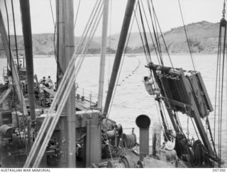 BOERA POINT, NEW GUINEA. 1943-10-01. BARGE TOWING CABLE FROM THE SS MERNOO TO THE SHORE