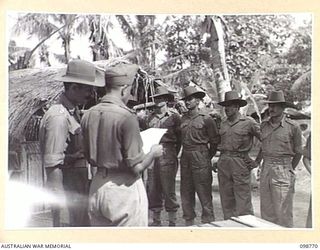 RABAUL, NEW BRITAIN. 1945-11-11. INDIAN ARMY TROOPS, FORMER PRISONERS OF WAR, ON PARADE AT HEADQUARTERS 11 DIVISION. THEY ARE TO ASSIST THE WAR CRIMES COMMISSION WHO HAVE ARRANGED AN IDENTIFICATION ..