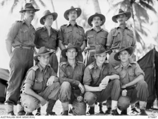 Officers of Headquarters, 25th Infantry Battalion. Identified personnel are: (back row, left to right) B2/350 Captain (Capt) W H Johns, Salvation Army; NX168148 Capt J E Aiken, medical officer; ..