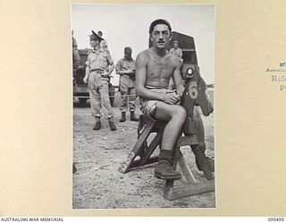 JACQUINOT BAY, NEW BRITAIN, 1945-08-23. LEADING AIRCRAFTMAN J. HOLLINGS, ROYAL NEW ZEALAND AIR FORCE RIDING "HOME'S THE CAPER" (BY EVACUATION OUT OF JACQUINOT BAY) DURING THE VICTORY CUP RACE ..