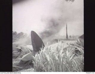 MILNE BAY, PAPUA, C.1943-04-13. LOCKHEED P38 AIRCRAFT WHICH CRASHED ON OVER RUN FROM NO. 1 STRIP (GURNEY FIELD). (DONOR - T.G. JONES)