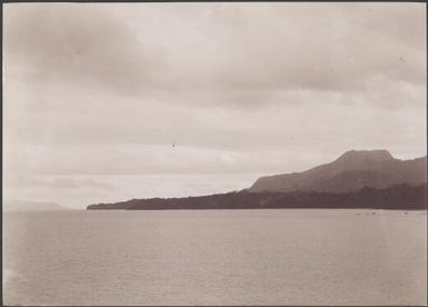 North-west extremity of Guadalcanar with Savo Island in the distance, Solomon Islands, 1906 / J.W. Beattie